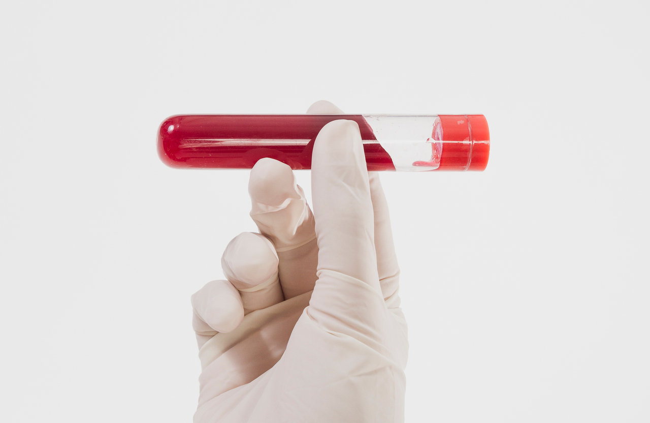 hand-holding-test-tube.jpg