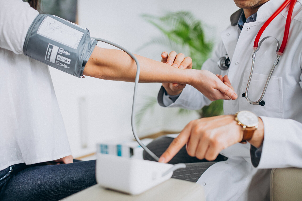 young-male-psysician-with-patient-measuring-blood-pressure.jpg